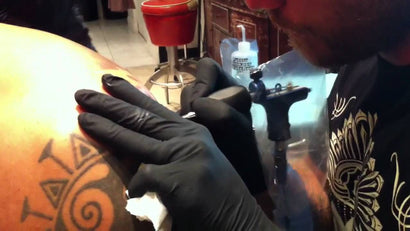 Spektra Rotary, Johan Finne tattooing my back